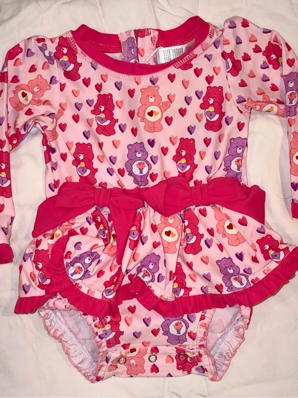 Ruffle Butts X Care Bears 1 piece swimsuit/rashguard sz 18-24 months NWT
